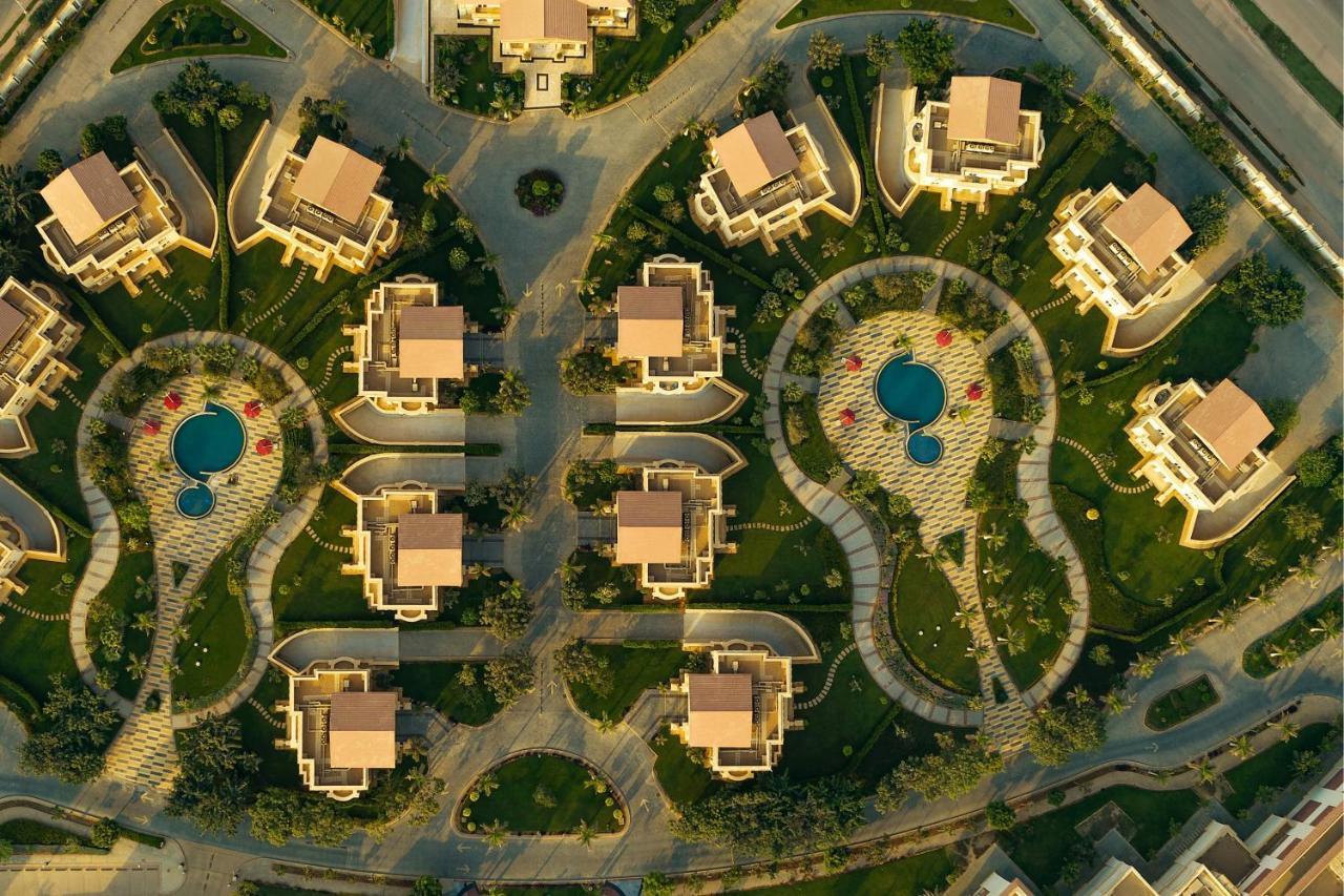 The St Regis New Capital Cairo Hotel Exterior photo Aerial view of a residential neighborhood in the city of El Alamein